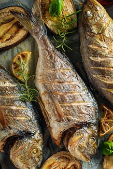 Grilled Gilt-head bream fish with vegetables and spices