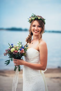 portrait of the bride against the background of the river.