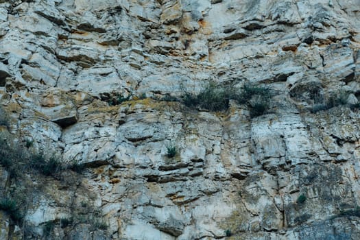 dark detailed grey stone background close up.