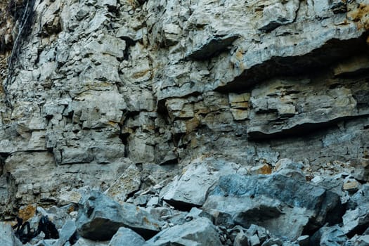 dark detailed grey stone background close up.