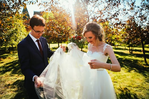bride and groom on background summer forest.