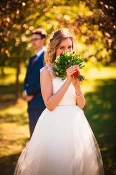 bride and groom on background summer forest.