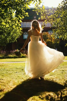 beautiful young bride in the garden background.