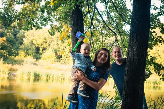 happy family with son on background forest