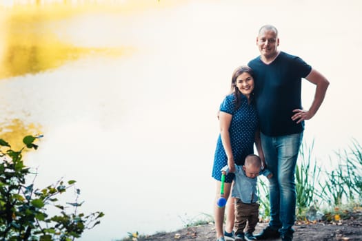 happy family with son on background forest