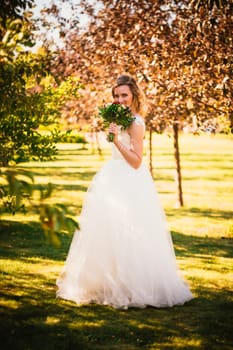 happy young bride on autumn forest background.