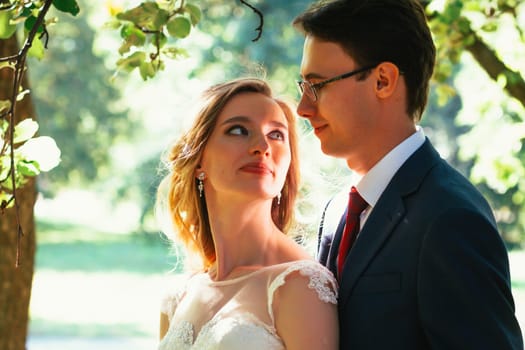 bride and groom on background summer forest.