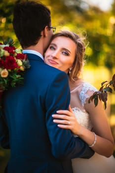 bride and groom on background summer forest.