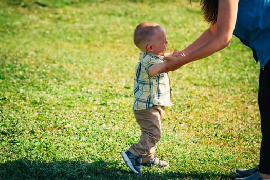crying toddler baby on nature background.