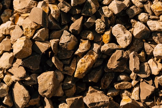 dark crushed stone close up in autumn.