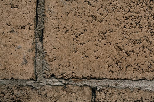 dark orange beige brick with cement close-up.