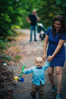 happy mother and toddler son on nature background.