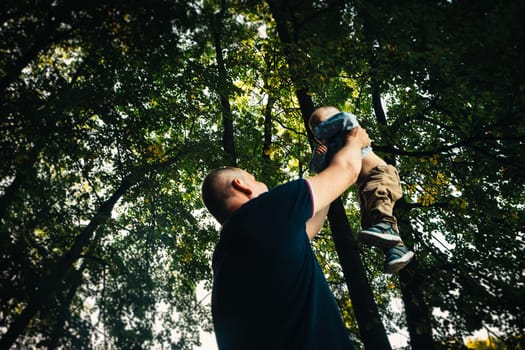 happy dad and baby on nature background.