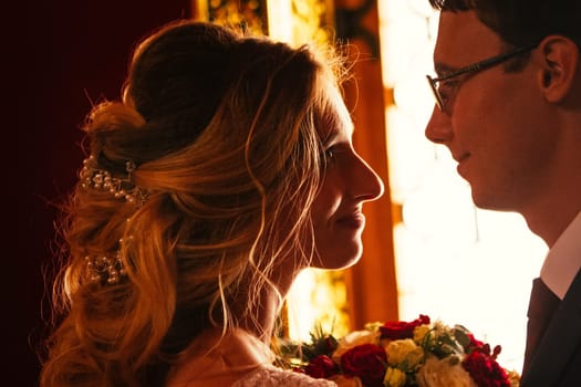 bride and groom on the background of the Kolomna Palace.