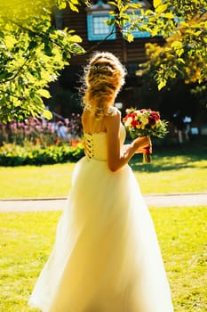 beautiful young bride in the garden background.