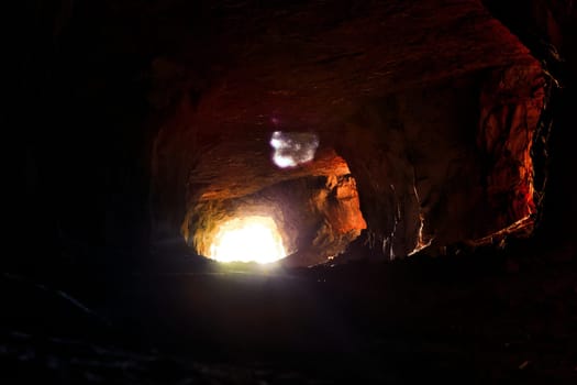 dark cave gallery limestone inside the mountain.