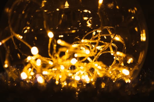 Christmas luminous garland on a dark background.
