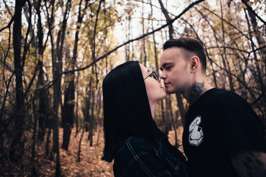 man and woman in the autumn forest