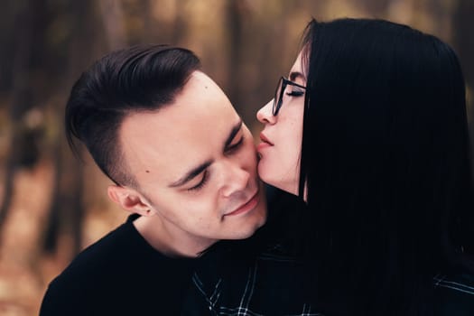 man and woman in the autumn forest