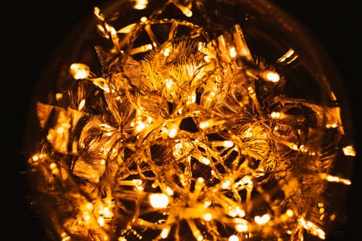 Christmas luminous garland on a dark background.