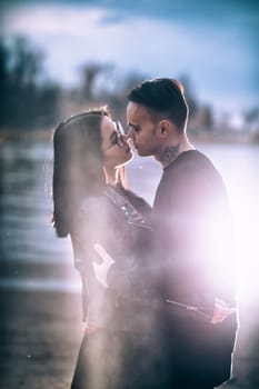 man and woman near the river autumn.
