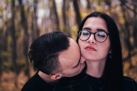 man and woman in the autumn forest
