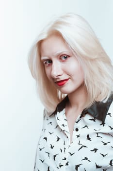portrait blonde albino girl in studio on white background.