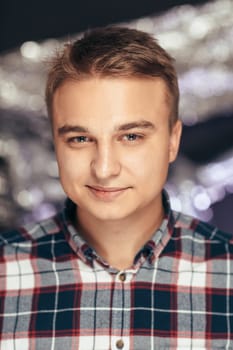 portrait of a young man on a blurred background.