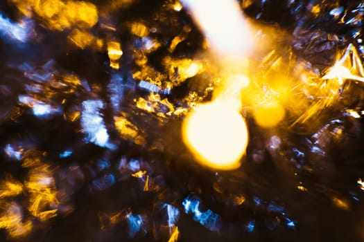 gold and silver bokeh on a dark background.