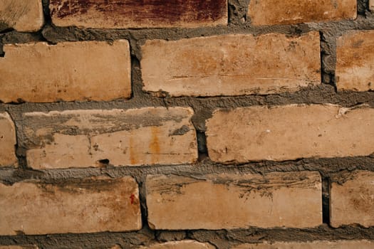 dark orange beige brick with cement close-up.