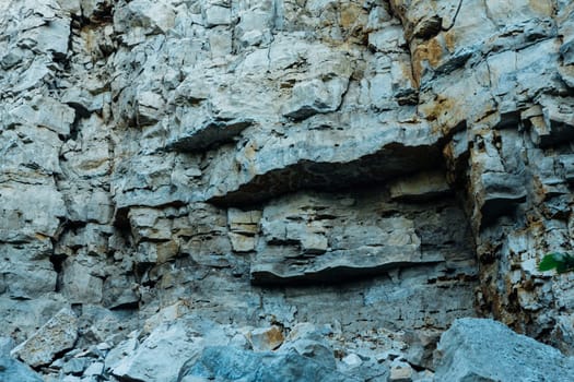 dark detailed grey stone background close up.