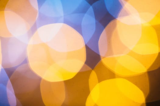 large gold and silver bokeh on a dark background.