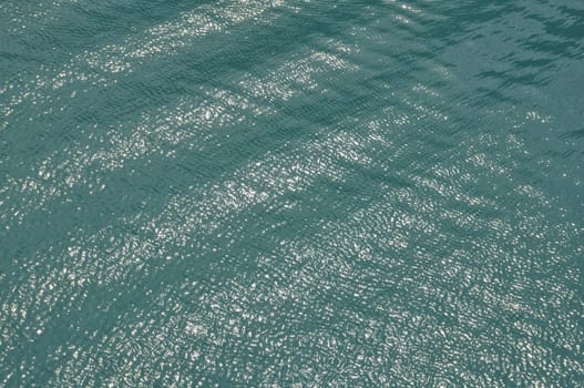 Light reflections on sea water on sunny summer day.