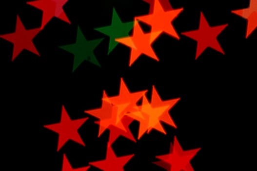 Colorful stars pattern abstract blur on black background.