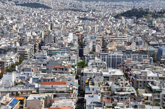 ATHENS, GREECE - APRIL 20, 2014: Apartment buildings aerial view densely populated eastern suburbs of the city of Athens, Greece.