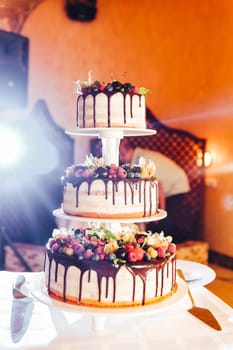 Wedding cake with strawberries, blackberries, blueberries cherries