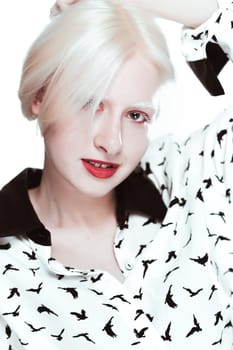 portrait of blonde albino girl in studio.