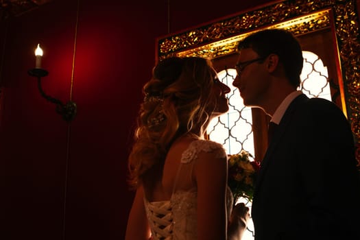 bride and groom on the background of the Kolomna Palace.