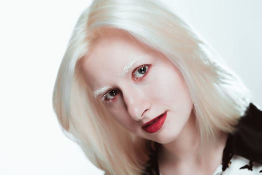 portrait of blonde albino girl in studio.
