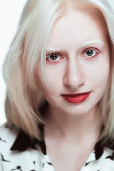 portrait of blonde albino girl in studio.