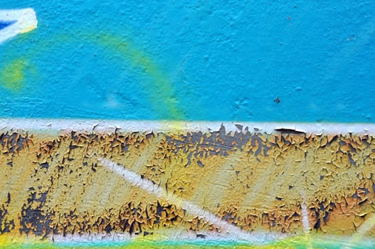 Weathered graffiti texture peeling paint and abstract smudged lines background.