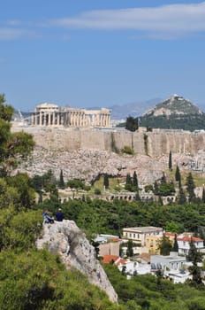 ATHENS, GREECE - APRIL 20, 2014: View of the Acropolis and Odeon of Herodes Atticus from Philopappos hill.