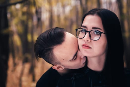 man and woman in the autumn forest