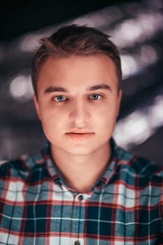 portrait of a young man on a blurred background.