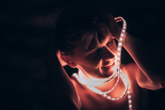 Portrait man Strip Light LED tape on dark color background.