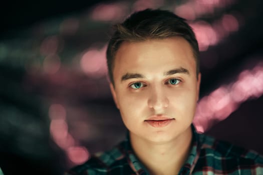 portrait of a young man on a blurred background.