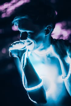 Portrait man Strip Light LED tape on dark color background.
