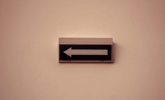 Exit arrow inside building, sign and symbol