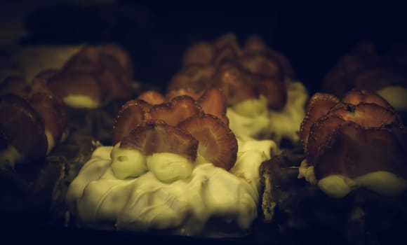 Strawberries with chocolate in pastry, desserts and sweets
