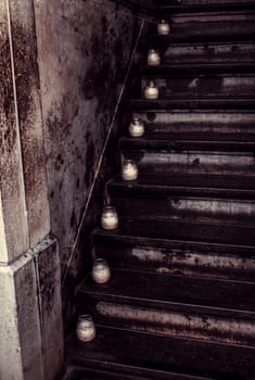Candles on a staircase, detail of lighting and decoration